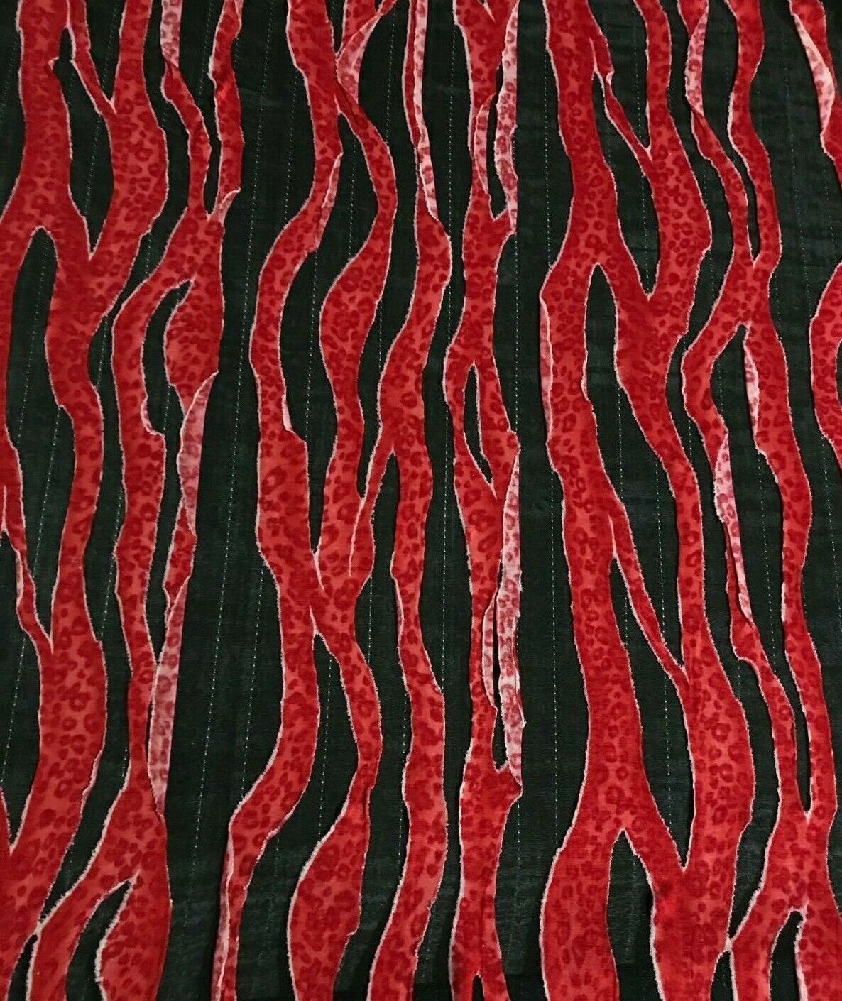 FABRIC JERSEY TEARED VISCOSE JERSEY SEWED ON THIN BLACK POLYESTER -SOLD BY METER