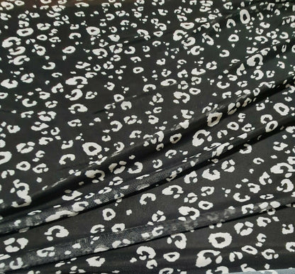 STRETCH NET TULLE FABRIC BLACK AND OFF WHITE LEOPARD PRINTED SOLD BY THE METRE