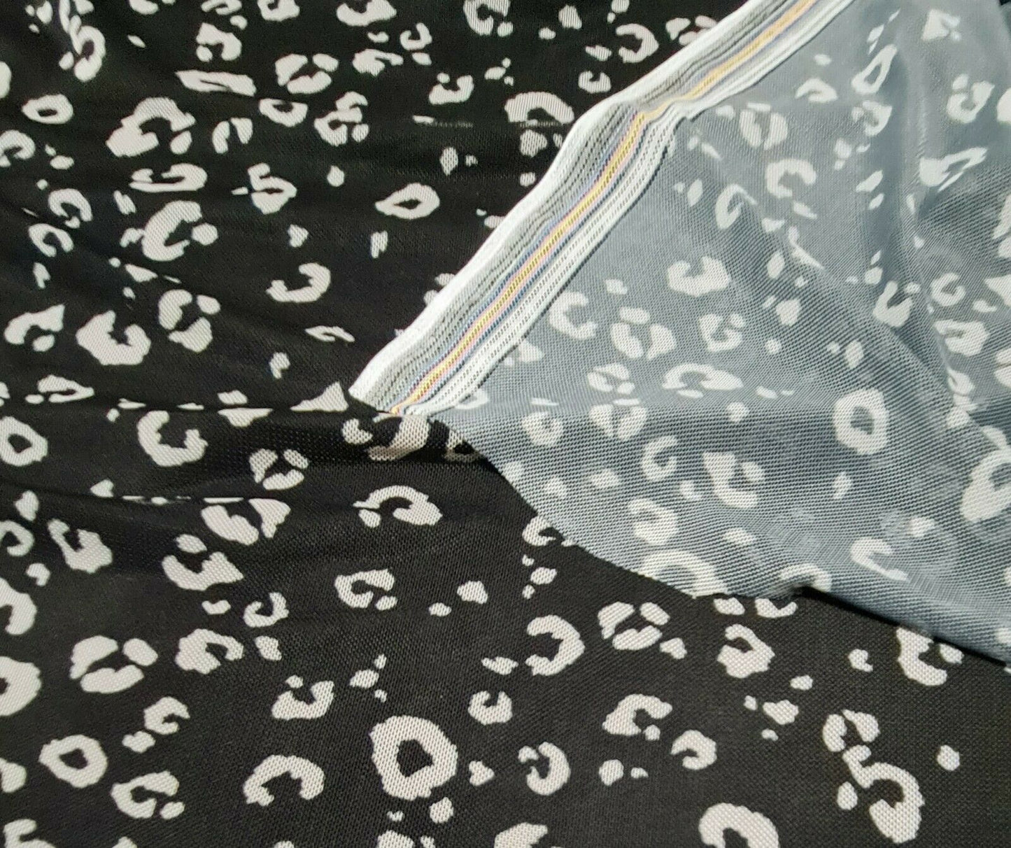 STRETCH NET TULLE FABRIC BLACK AND OFF WHITE LEOPARD PRINTED SOLD BY THE METRE