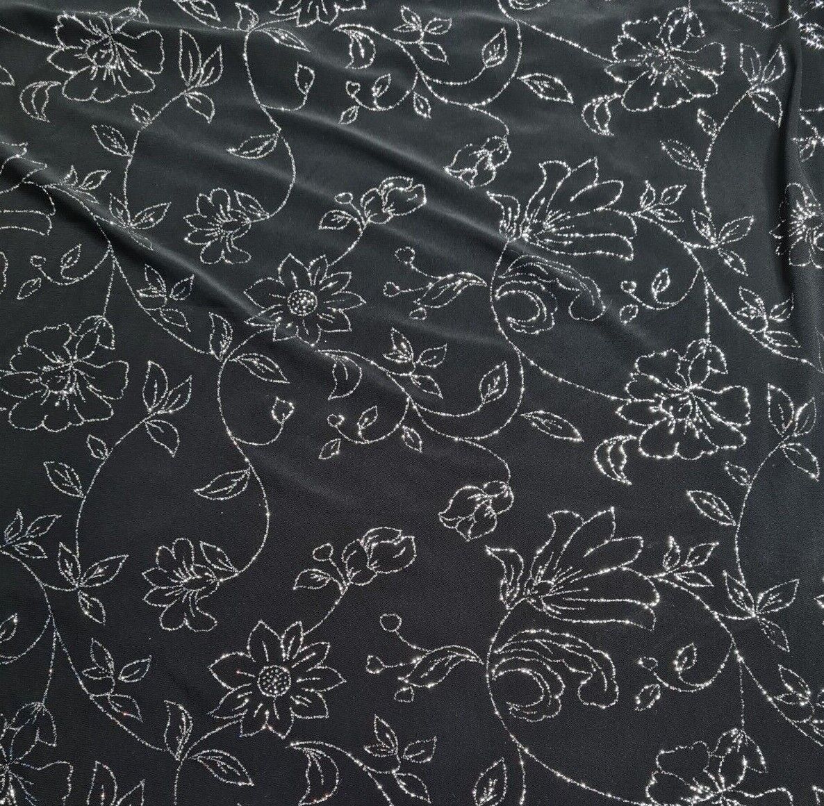 Shiny Jersey Fabric Silver Glitter Floral Black Colour 55" Wide 2 Way Stretch