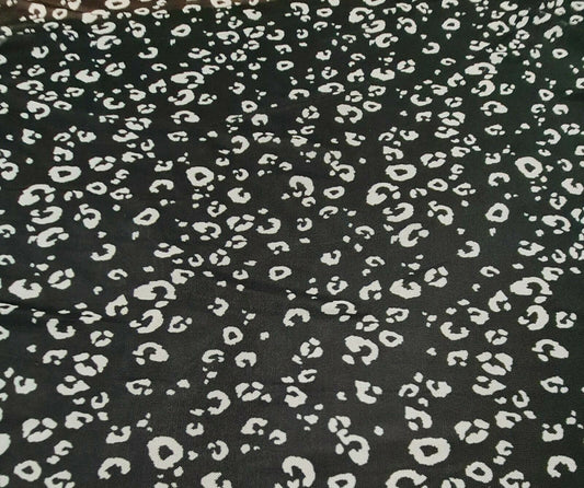 STRETCH NET TULLE FABRIC BLACK AND OFF WHITE LEOPARD PRINTED SOLD BY THE METRE